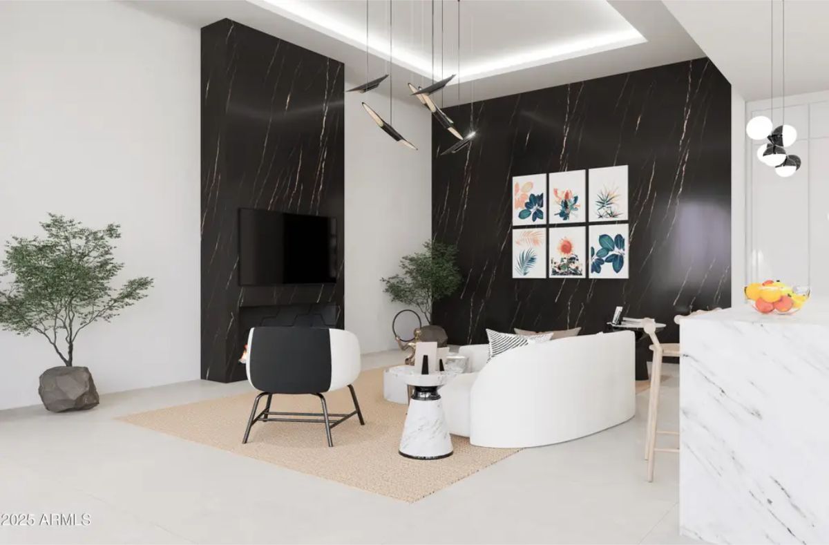 High ceilings and recessed lighting enhance the spacious feel of this modern living area.