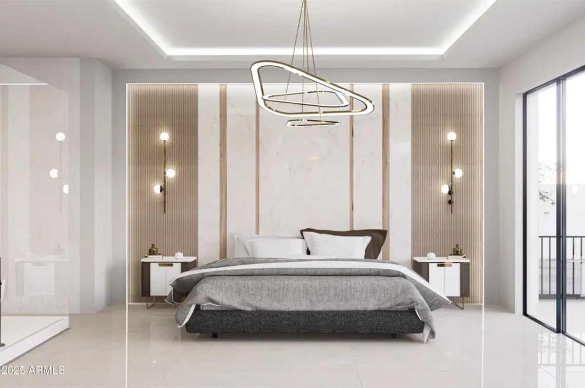 Marble-paneled wall with integrated lighting acts as a sophisticated backdrop for the bed.