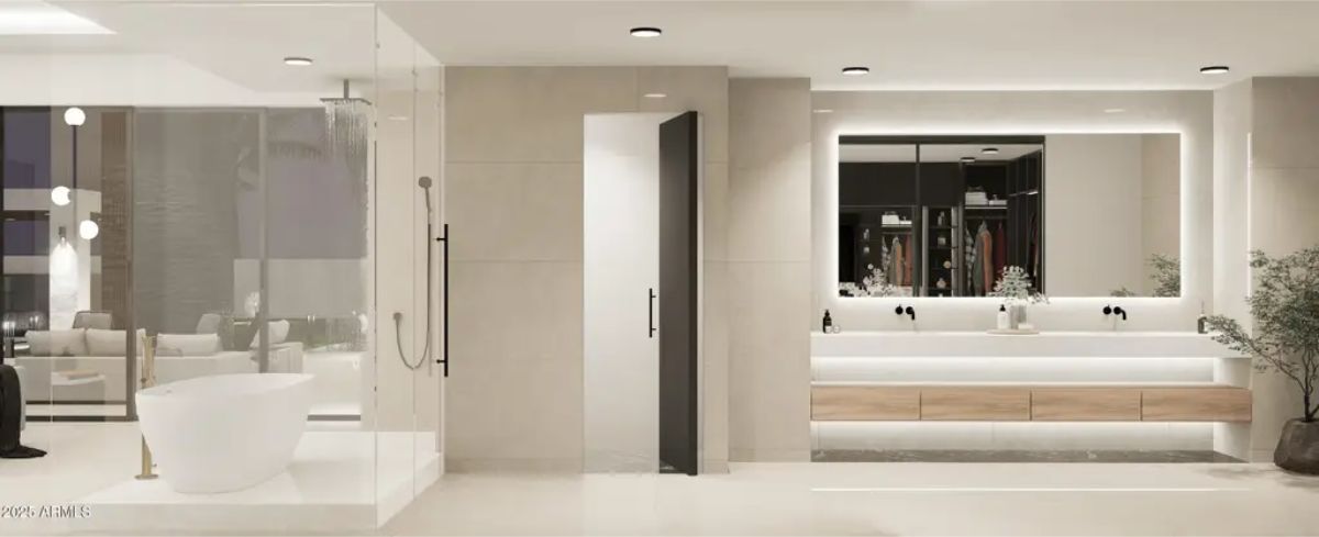 Freestanding white bathtub is placed near a full-length glass shower enclosure.