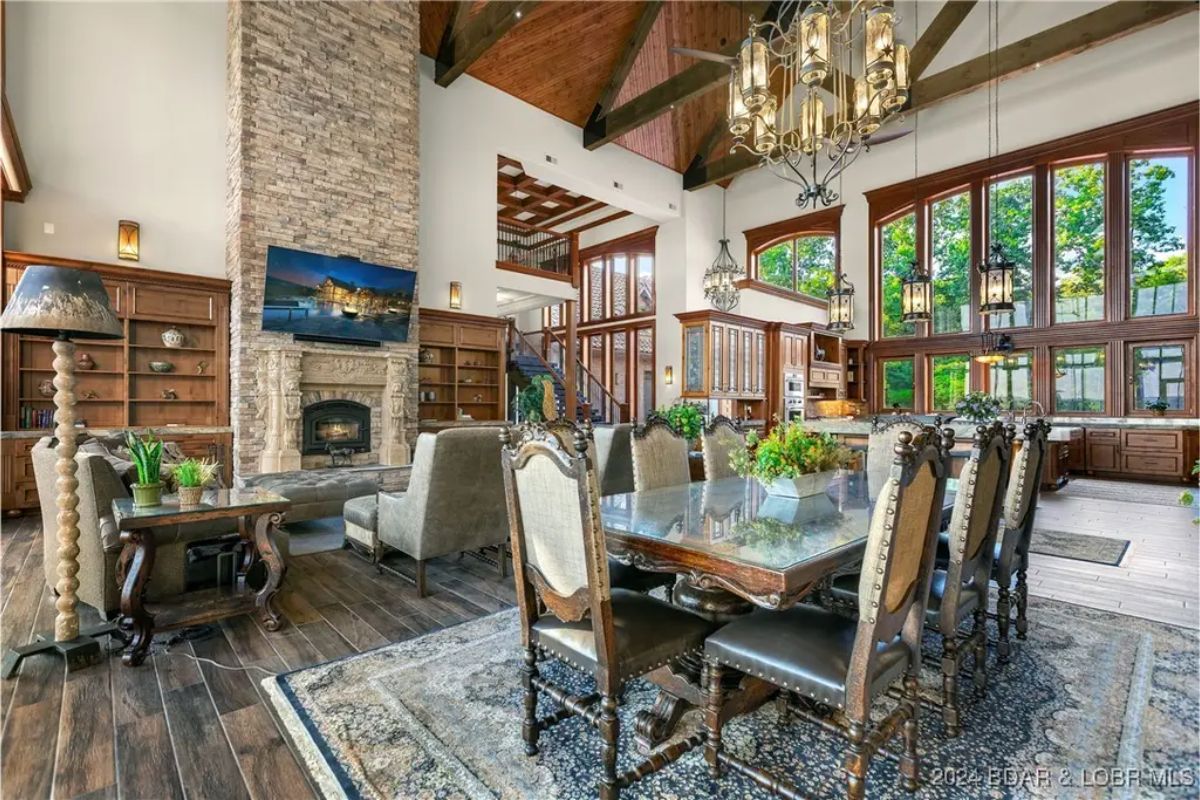 Open dining space with a long wooden table and high-back chairs.