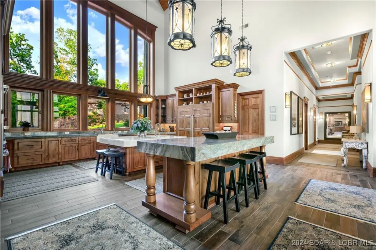 Spacious kitchen with a large center island and wooden cabinetry.
