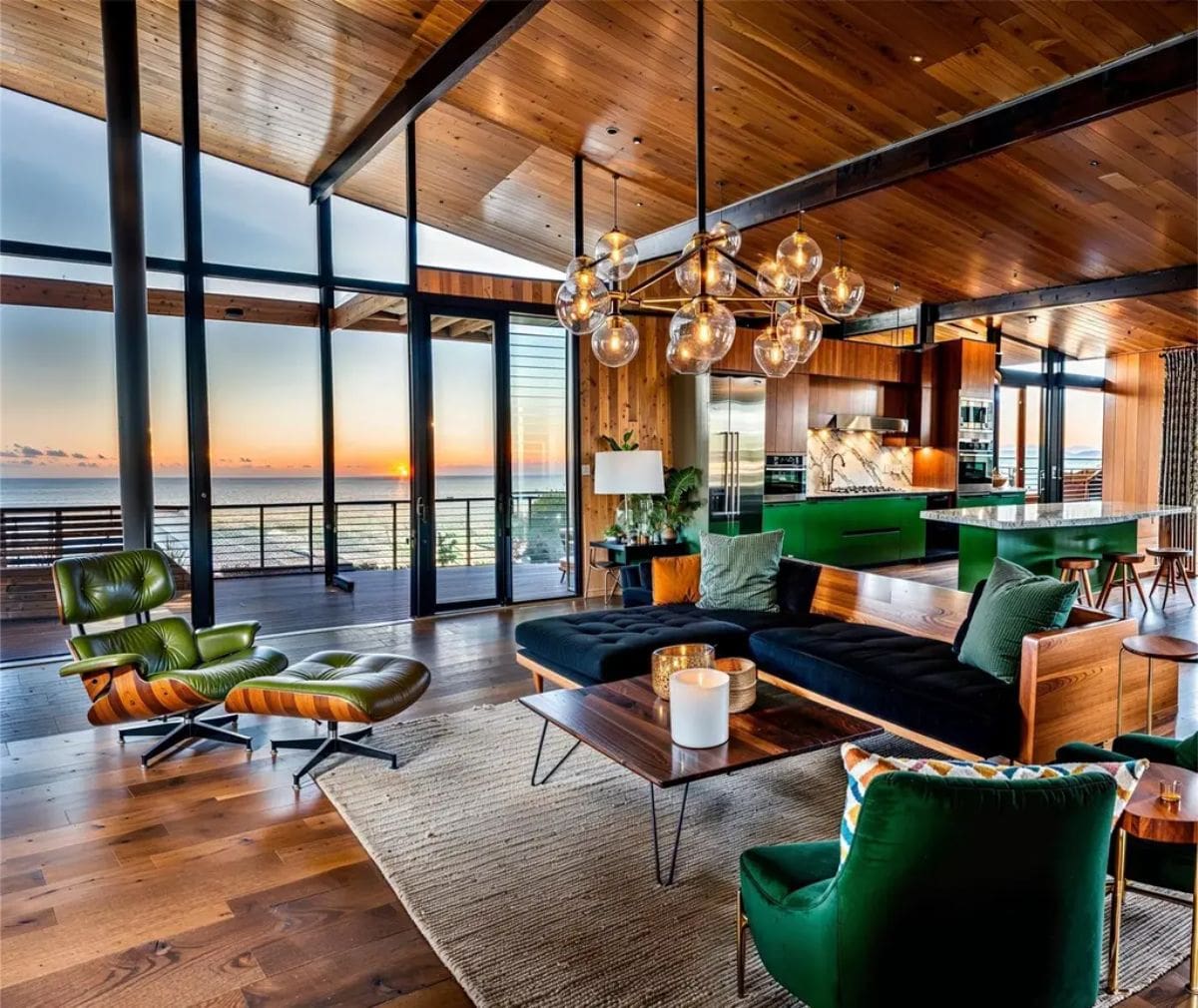 Open-concept living room blends natural wood, green accents, and stylish lighting with a breathtaking ocean view. 