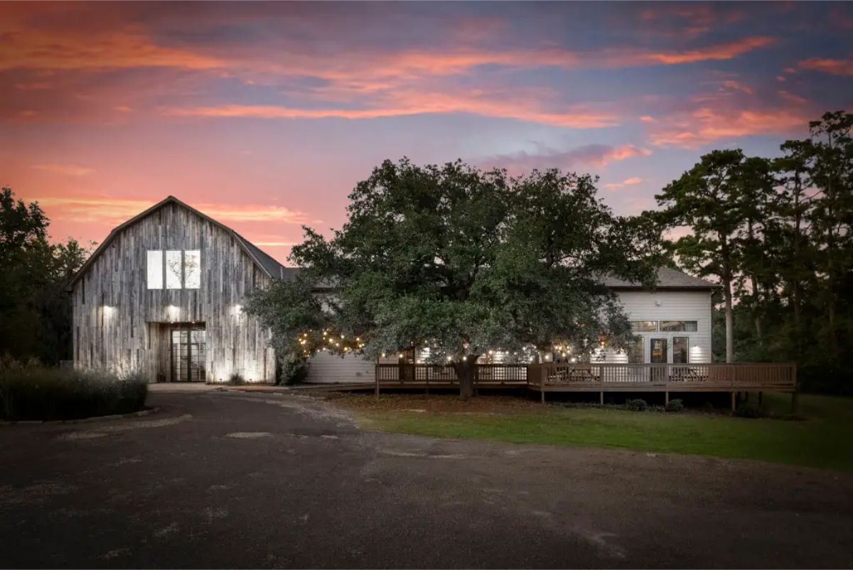 This $15,000,000 estate spans over 60 unrestricted acres and features 21 bedrooms, 23 bathrooms, and 22,000 sq. ft. of meticulously restored space across 11 buildings.