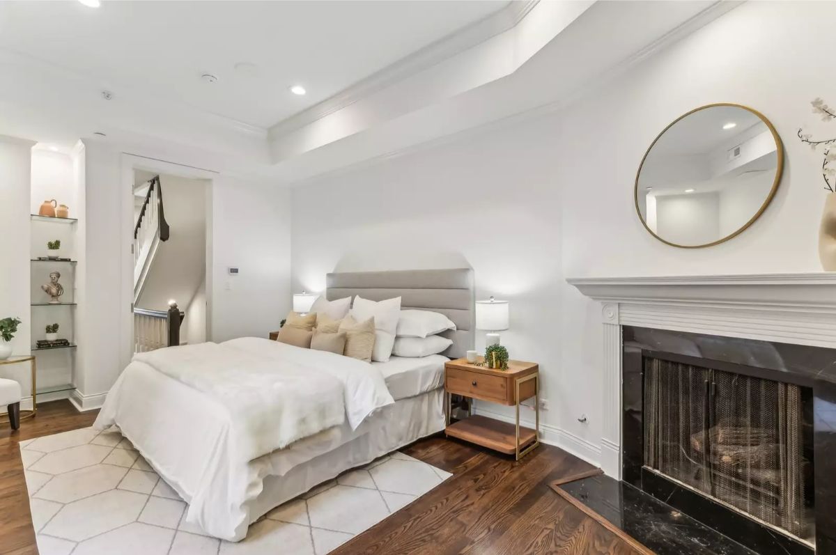 Plush bed with a padded headboard and matching nightstands.
