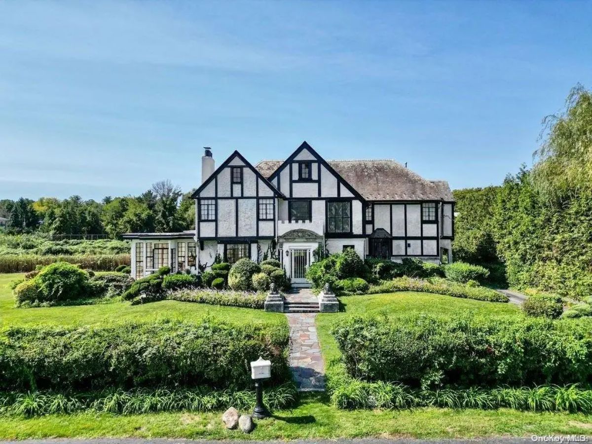 Priced at $3,880,000, this elegant 1928 Colonial home offers 5 bedrooms and 4 baths on over half an acre of scenic pond-front property.