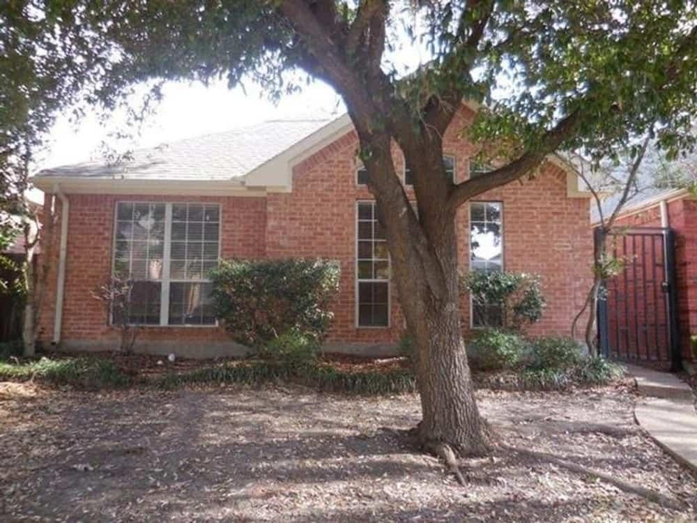 Charming Brick Facade with Twin Tall Windows