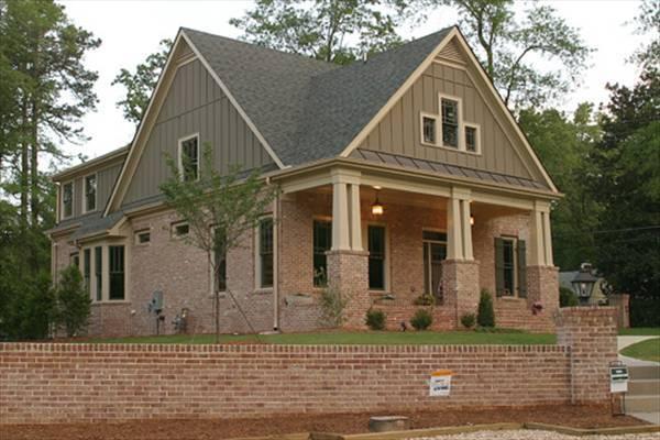 Classic Brick Facade with Gable Roof and Inviting Porch
