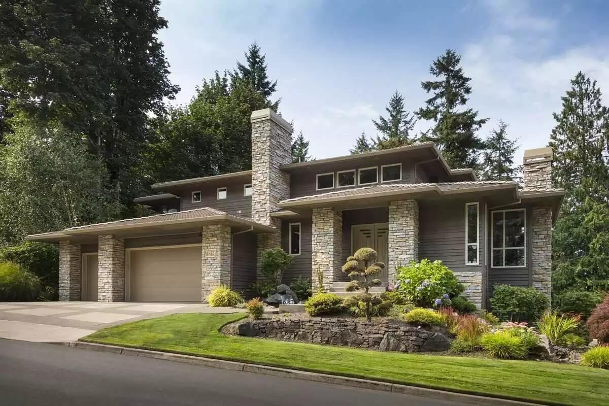 Modern Home with Striking Stone Facade and Lush Landscaping