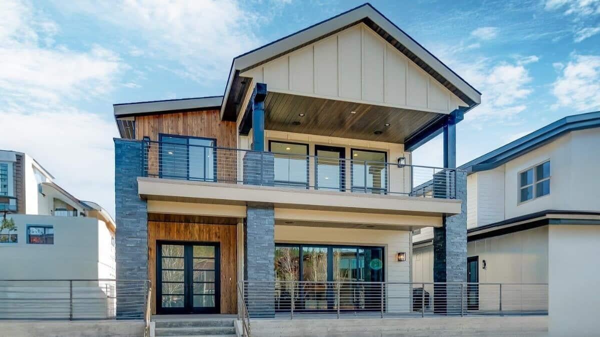 Modern Facade with Sleek Stone Accents and Upper Deck Views