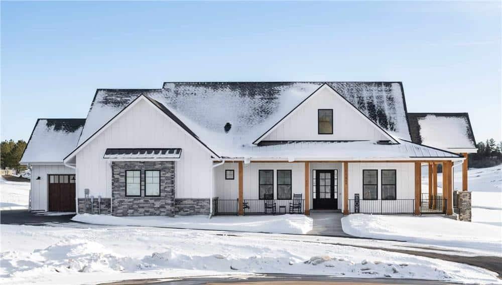 Snow-Kissed Modern Farmhouse with Striking Stone Accents