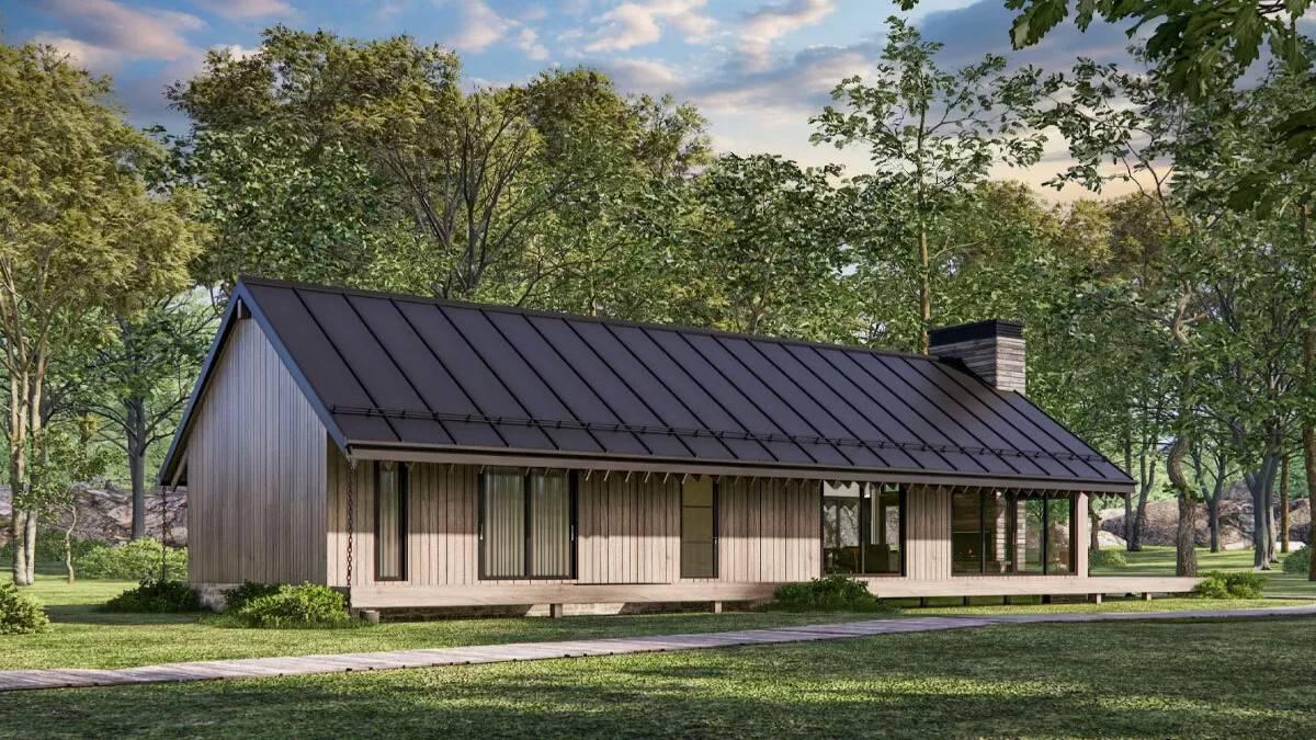 Sleek Cabin with a Striking Metal Roof Against the Forest Backdrop