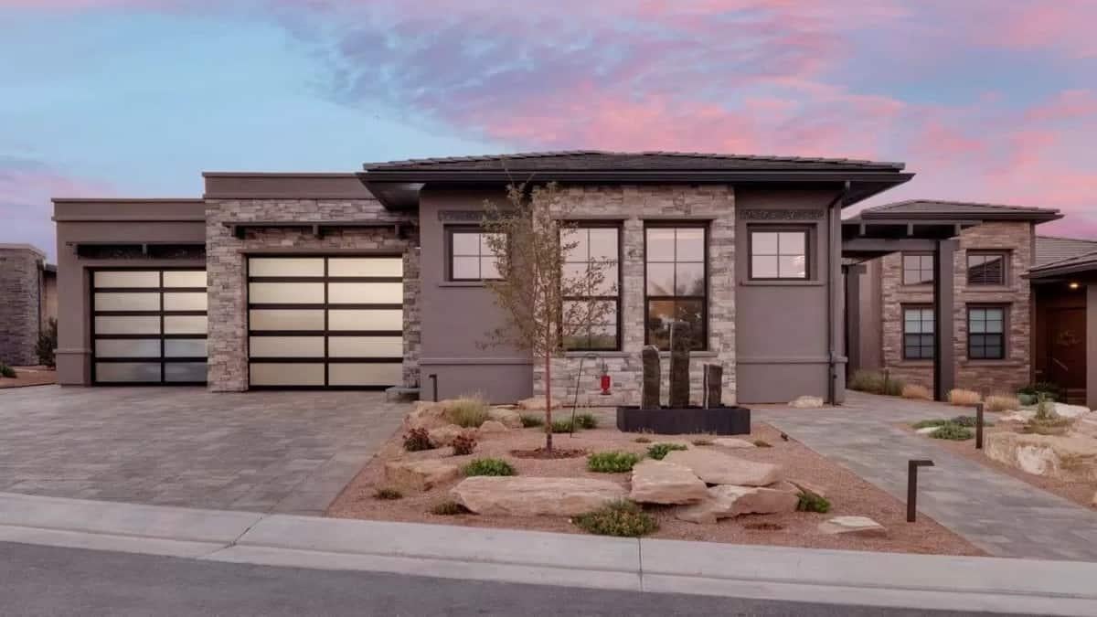 Modern Marvel with Sleek Garage Doors and Stone Accents