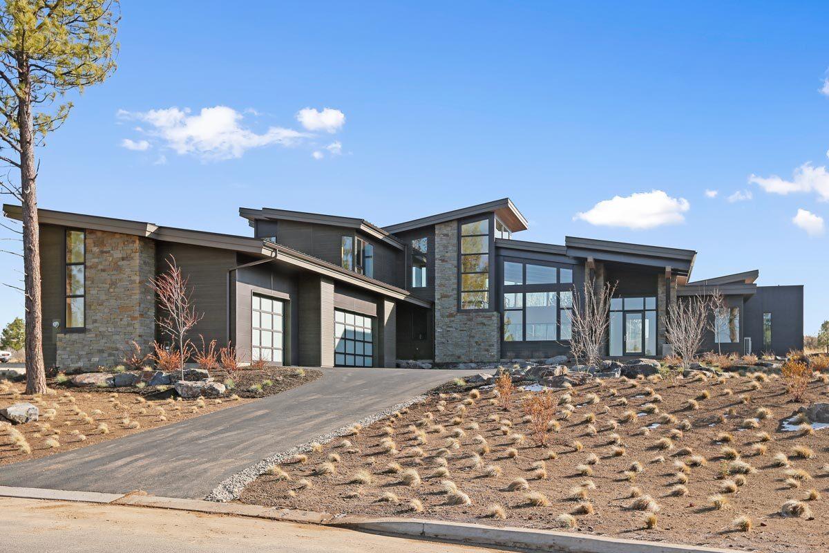 Modern Marvel with Striking Stone Accents and Expansive Windows