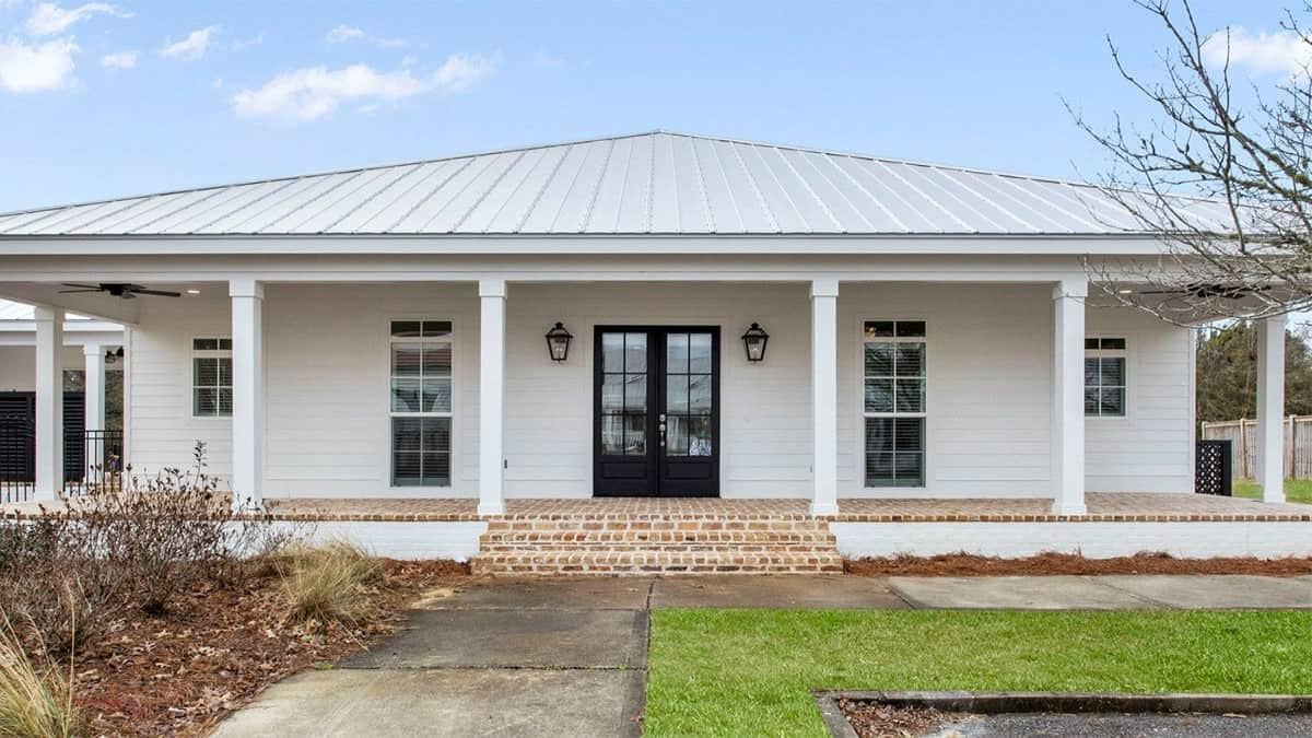 Classic Southern Porch with Brick Detailing and Metal Roof