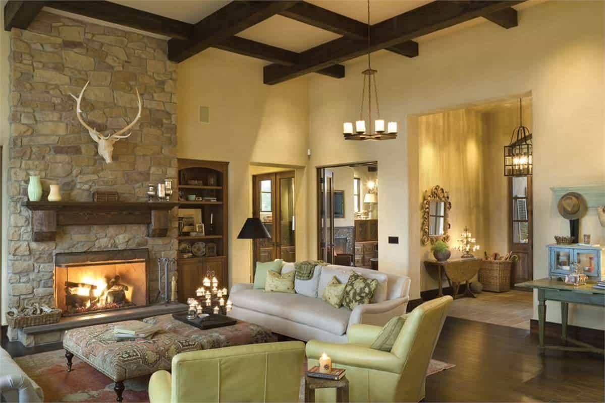 Rustic Living Room with a Striking Stone Fireplace and Warm Tones
