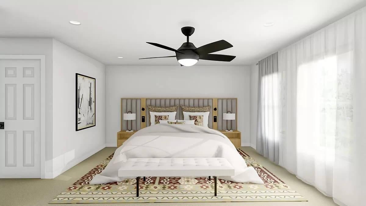 Modern Bedroom Featuring a Bold Ceiling Fan and Artistic Flair