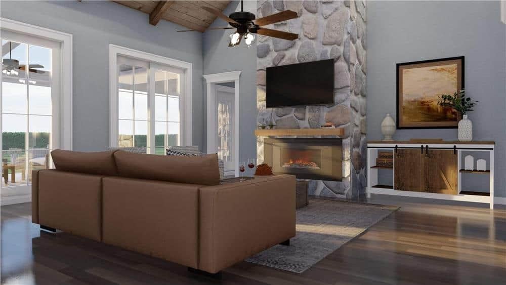 Rustic Living Area with a Striking Stone Fireplace