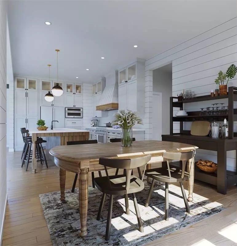 Appreciate the Blend of Shiplap Walls and Elegant Wooden Details in This Open Kitchen