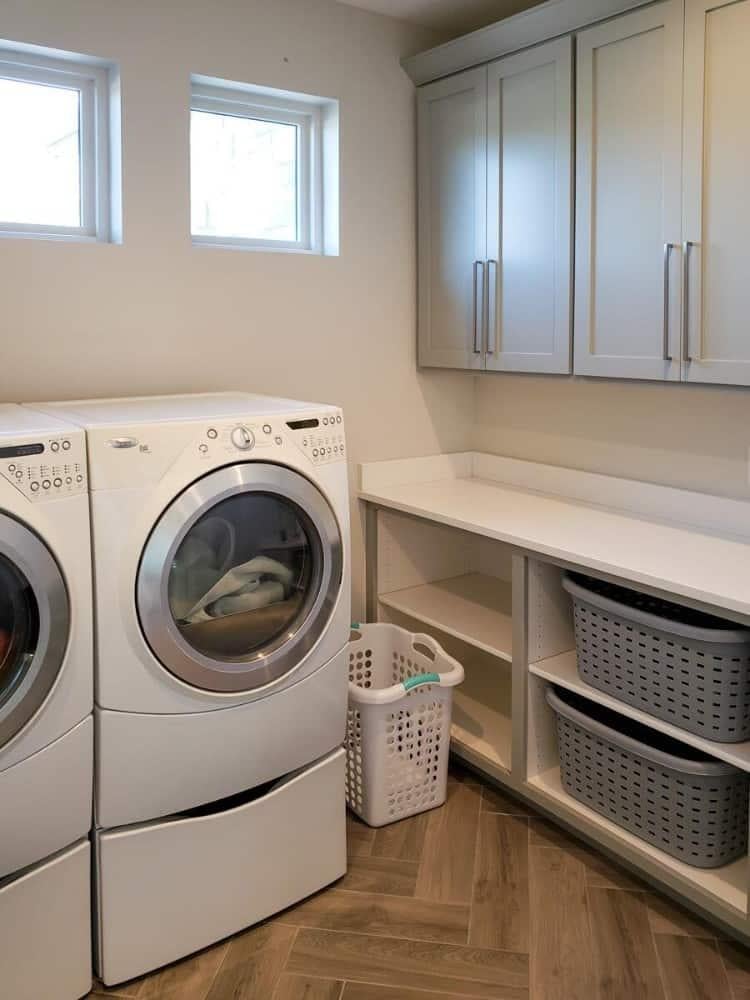 Laundry Room with Clever Cabinetry and Sleek Washer-Dryer Combo