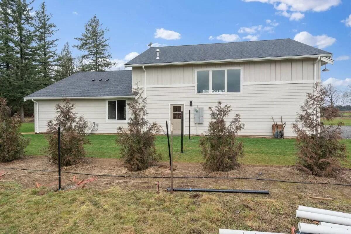 Simple Back View with Tall Windows and Young Landscaping