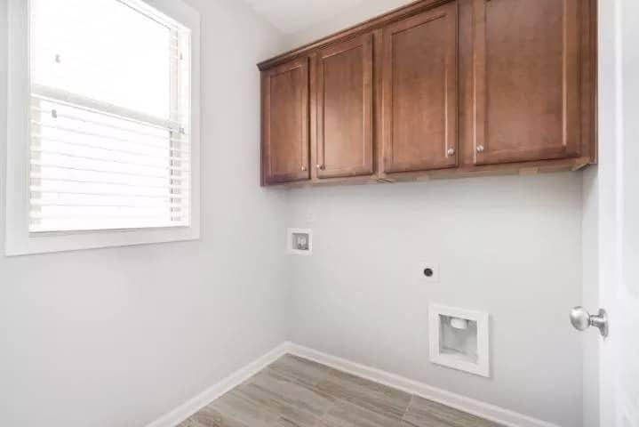 Functional Laundry Space With Classic Wooden Cabinets