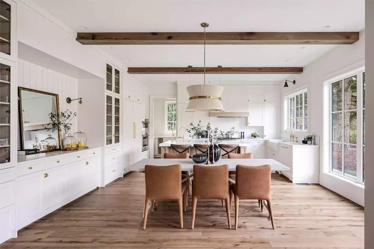 This Dining Room Features a Stunning Buffet Display and Exposed Beams