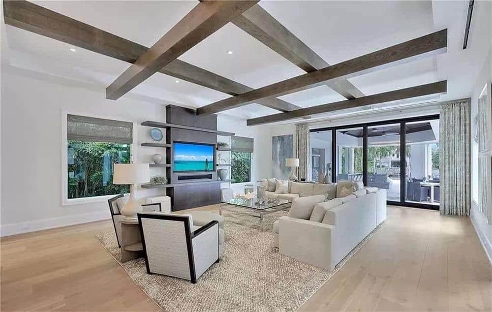 Explore This Living Room With Exposed Beams and Backyard Views