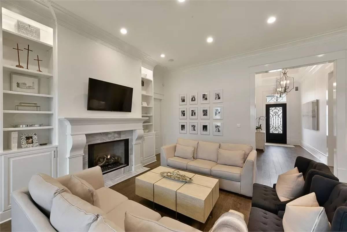 Cozy Sitting Area with Built-In Shelves and Fireplace