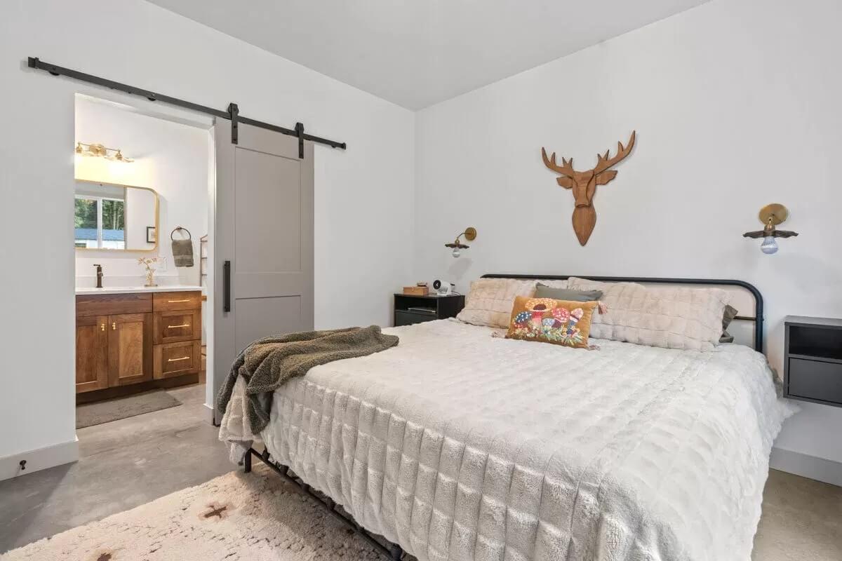 Barn Door Charm Meets Subtle Lodge Vibes in This Bedroom Retreat