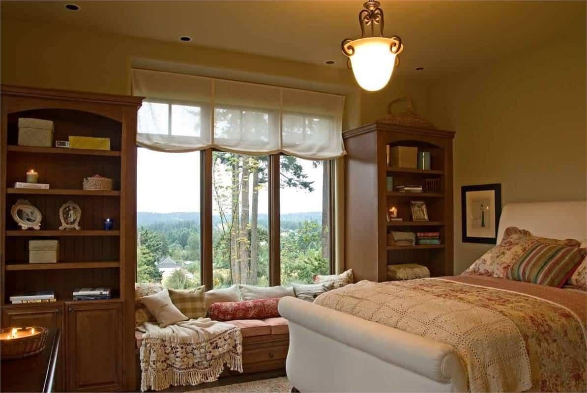 Cozy Bedroom Nook with Inviting Window Seat and Bookcases
