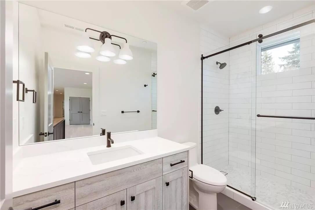Simplicity Shines in this Bathroom with Modern Fixtures
