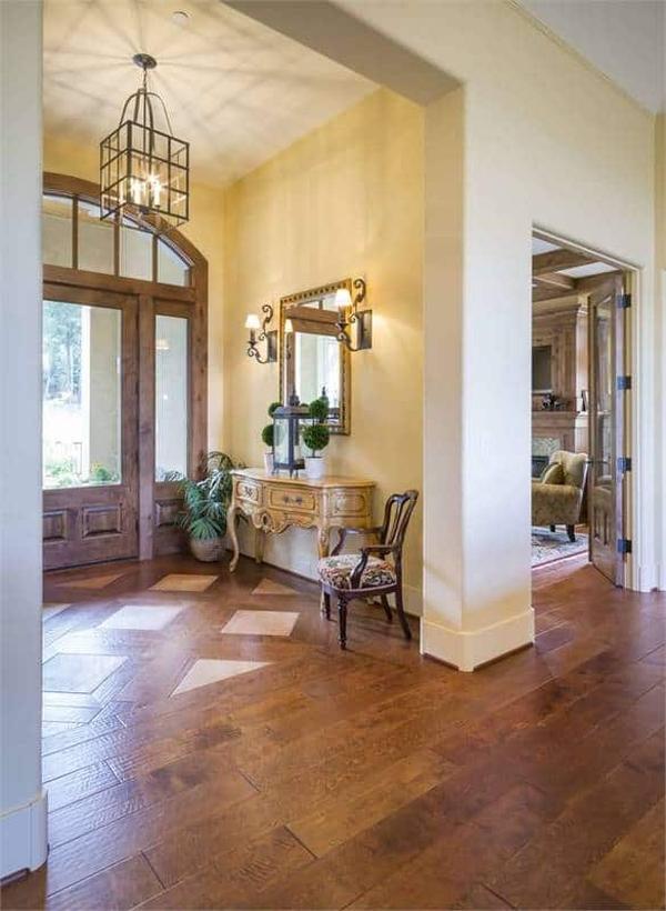 Notice the Intricate Wood Flooring in This Elegant Foyer