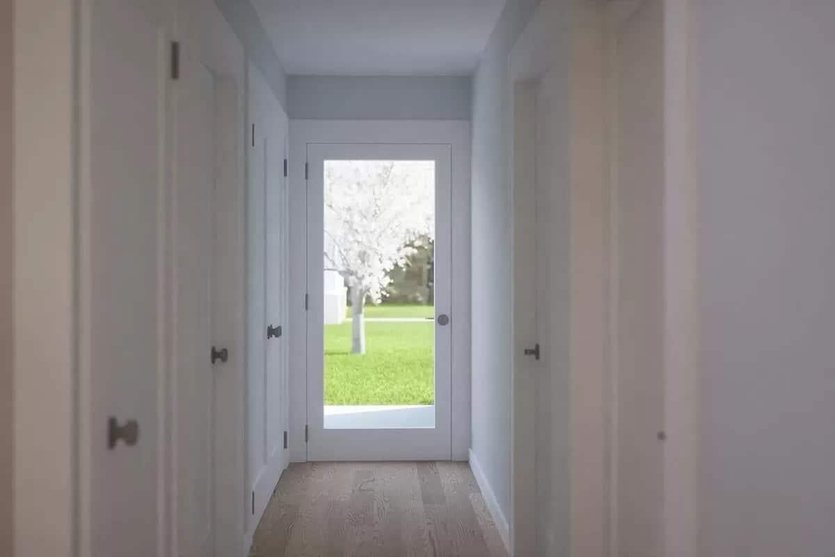 Simple Hallway Leading to a Bright Outdoor View