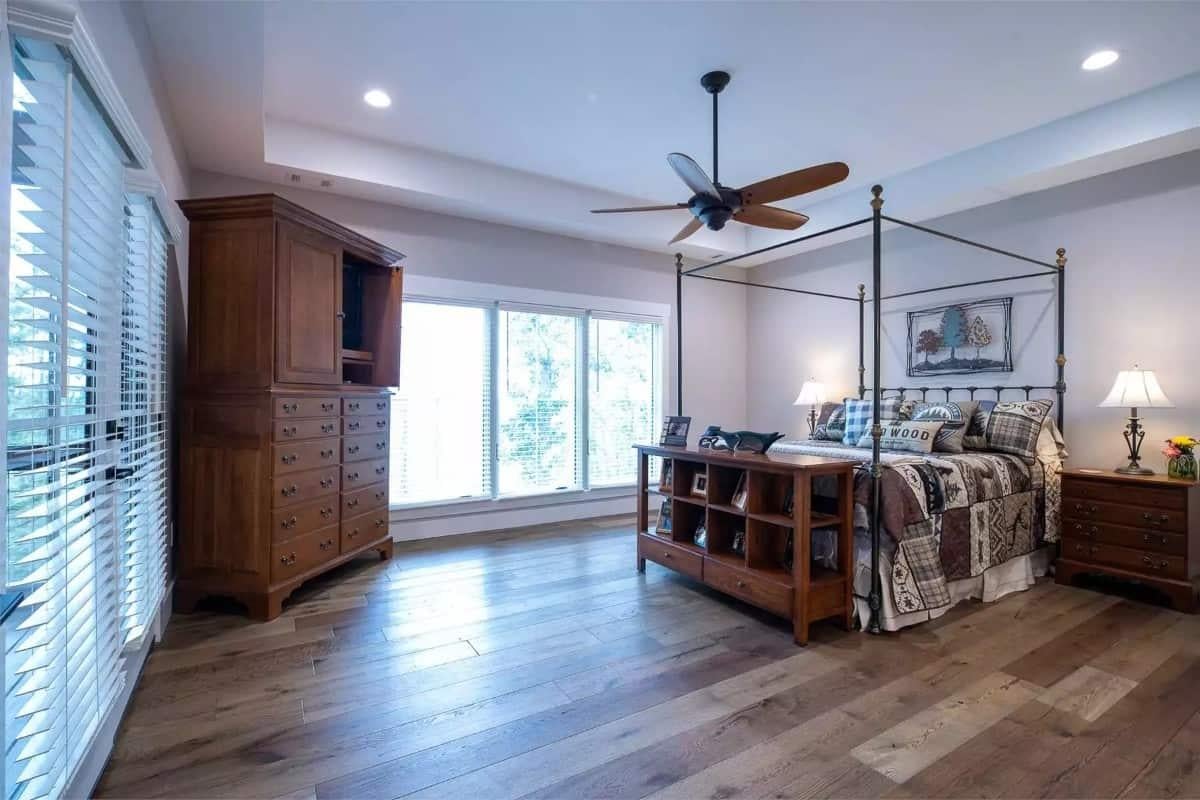 Expansive Bedroom with a Bold Four-Poster Bed and Wooden Accents
