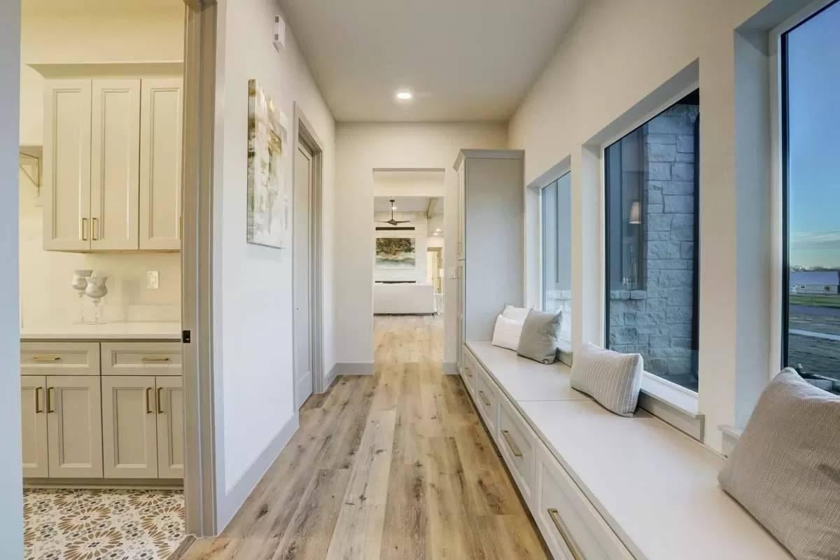 Charming Hallway with Inviting Window Seat and Storage