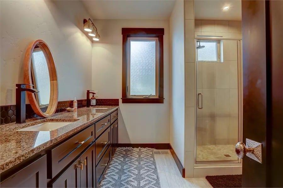 Bold Modern Craftsman Bathroom with a Striking Round Mirror