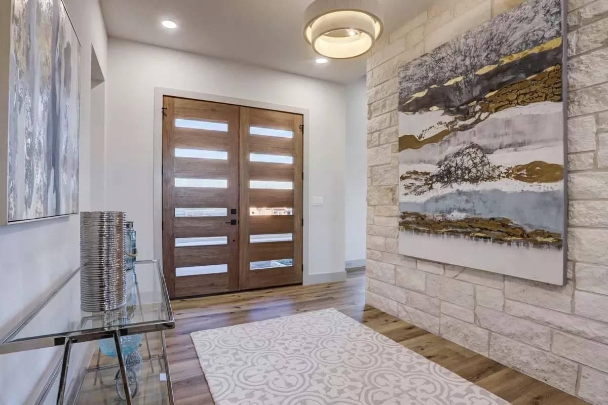 Welcoming Entryway with Eye-Catching Stone Accent Wall