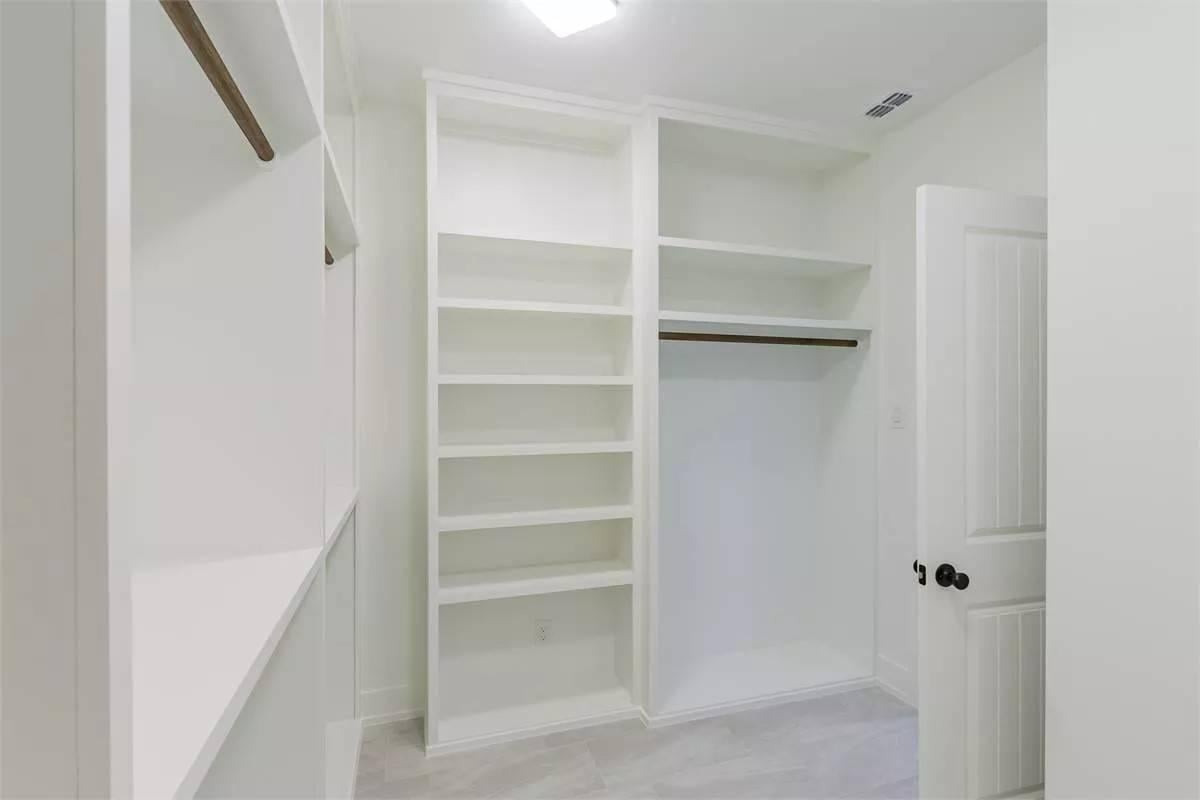 Simple and Efficient Storage in This Walk-In Closet Design
