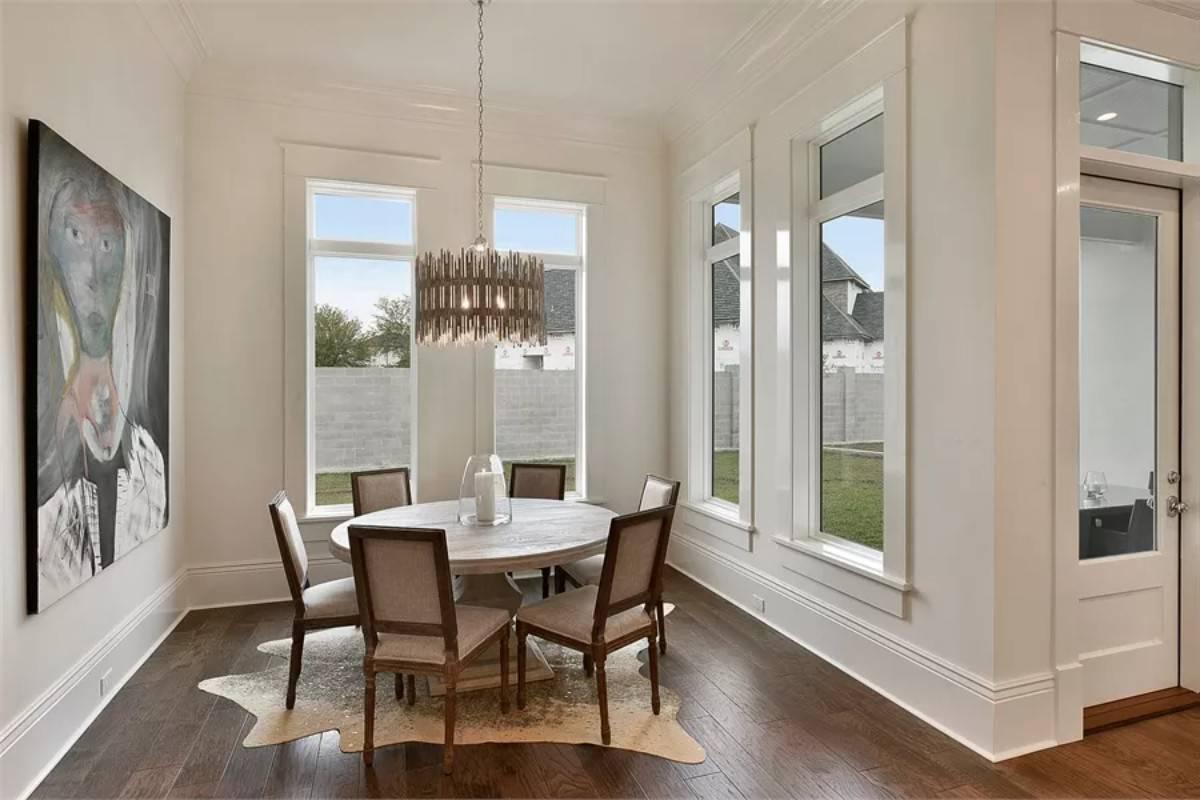 Unique Chandelier Complements the Sleek Dining Space