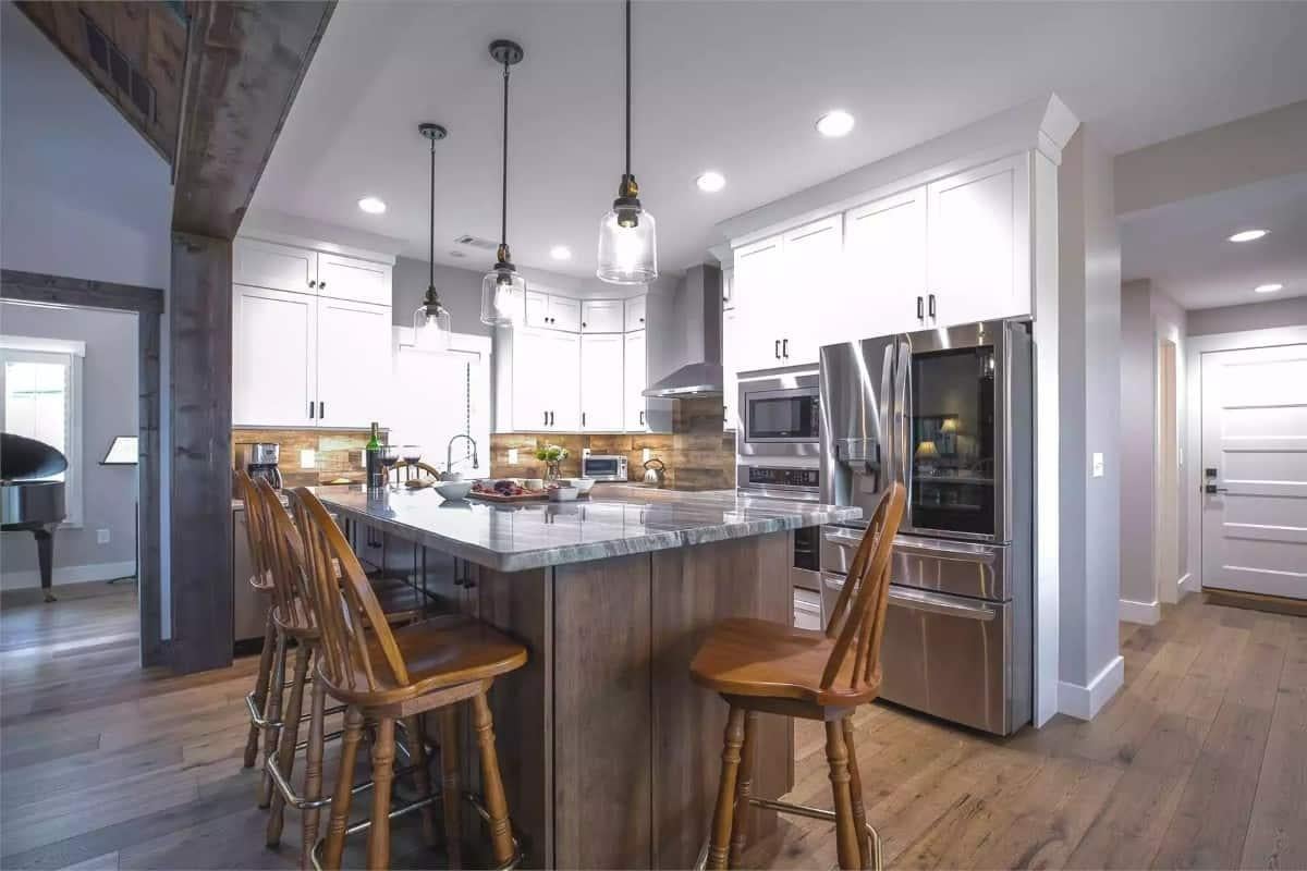 Rustic Modern Kitchen with a Striking Island and Pendant Lights