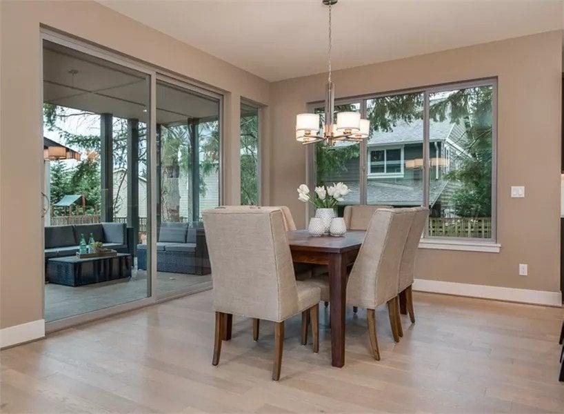 Dining Room with Expansive Windows Overlooking the Patio