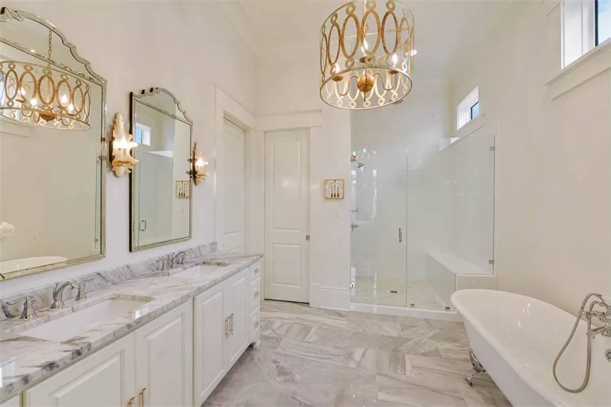 Luxurious Bathroom with a Statement Chandelier and Freestanding Tub