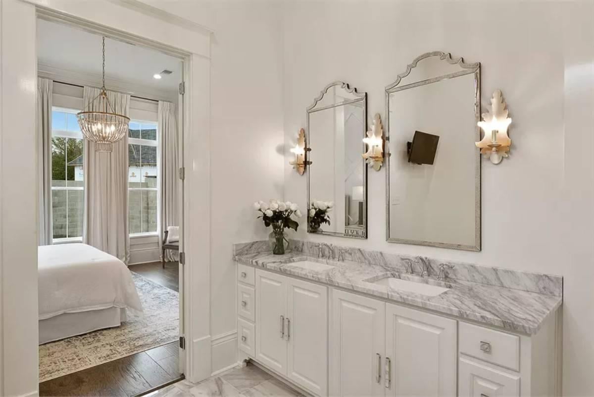 Dual Mirrors and Marble Countertops Highlight This Elegant Vanity