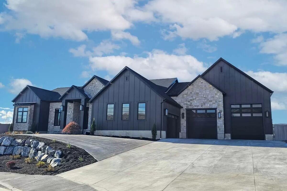 Stunning Contemporary Facade with Dark Paneling and Stone Accents