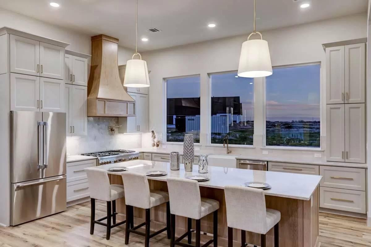 Elegant Kitchen with Centerpiece Island and Custom Hood