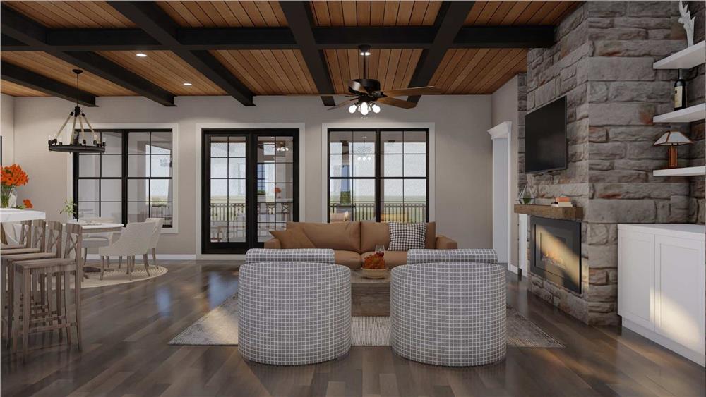 Living Area Featuring a Textured Stone Fireplace and Expansive Ceiling