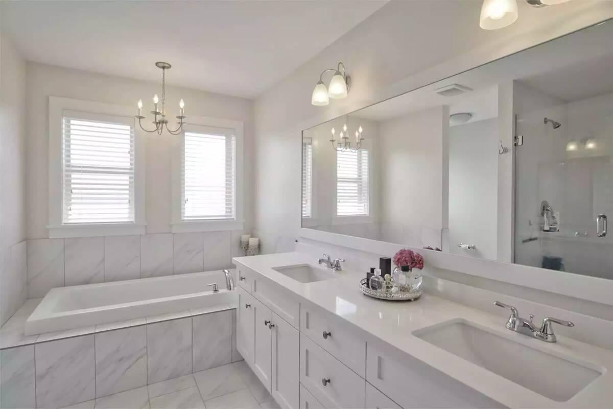 Classic Bathroom Elegance with Twin Sinks and a Deep Soak Tub