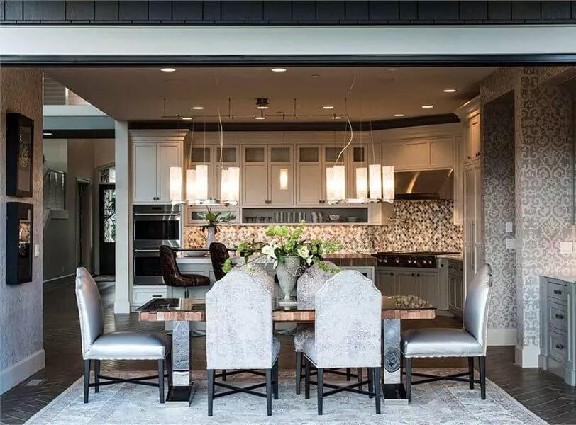 Notice the Chic Pendant Lights Above This Elegant Open Dining Space