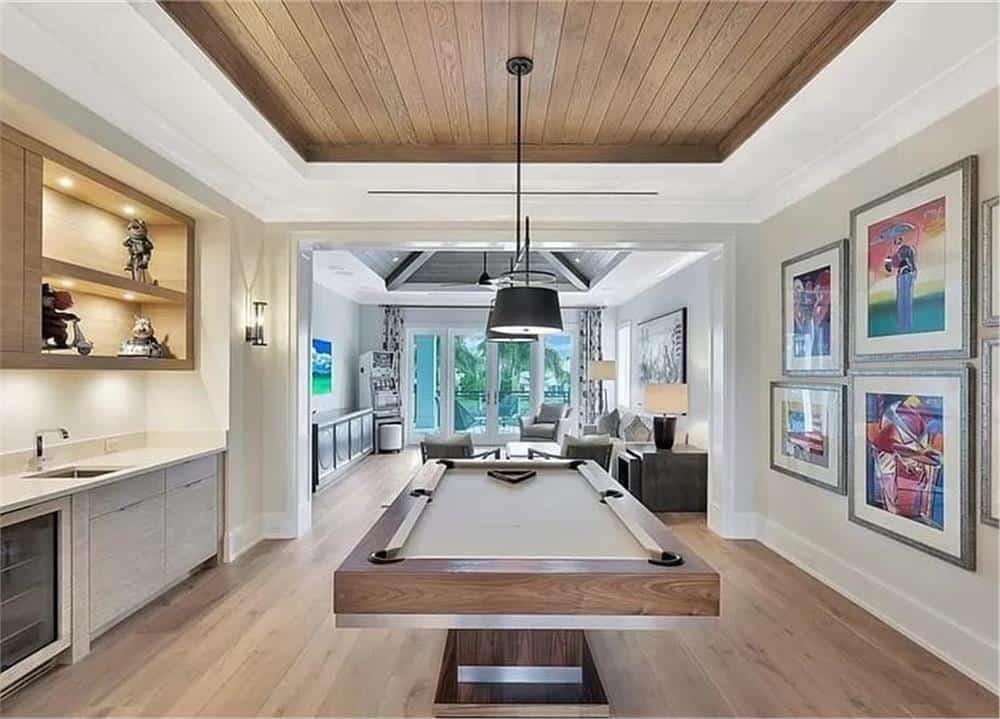 Explore This Game Room With a Sleek Billiard Table and Warm Wood Tones