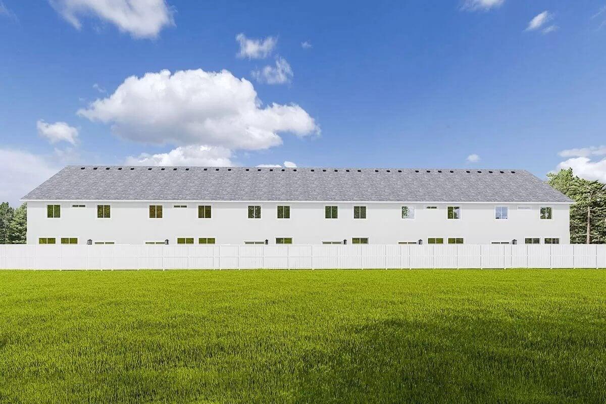 Long Stretch of Townhomes with Crisp White Finish Against a Blue Sky